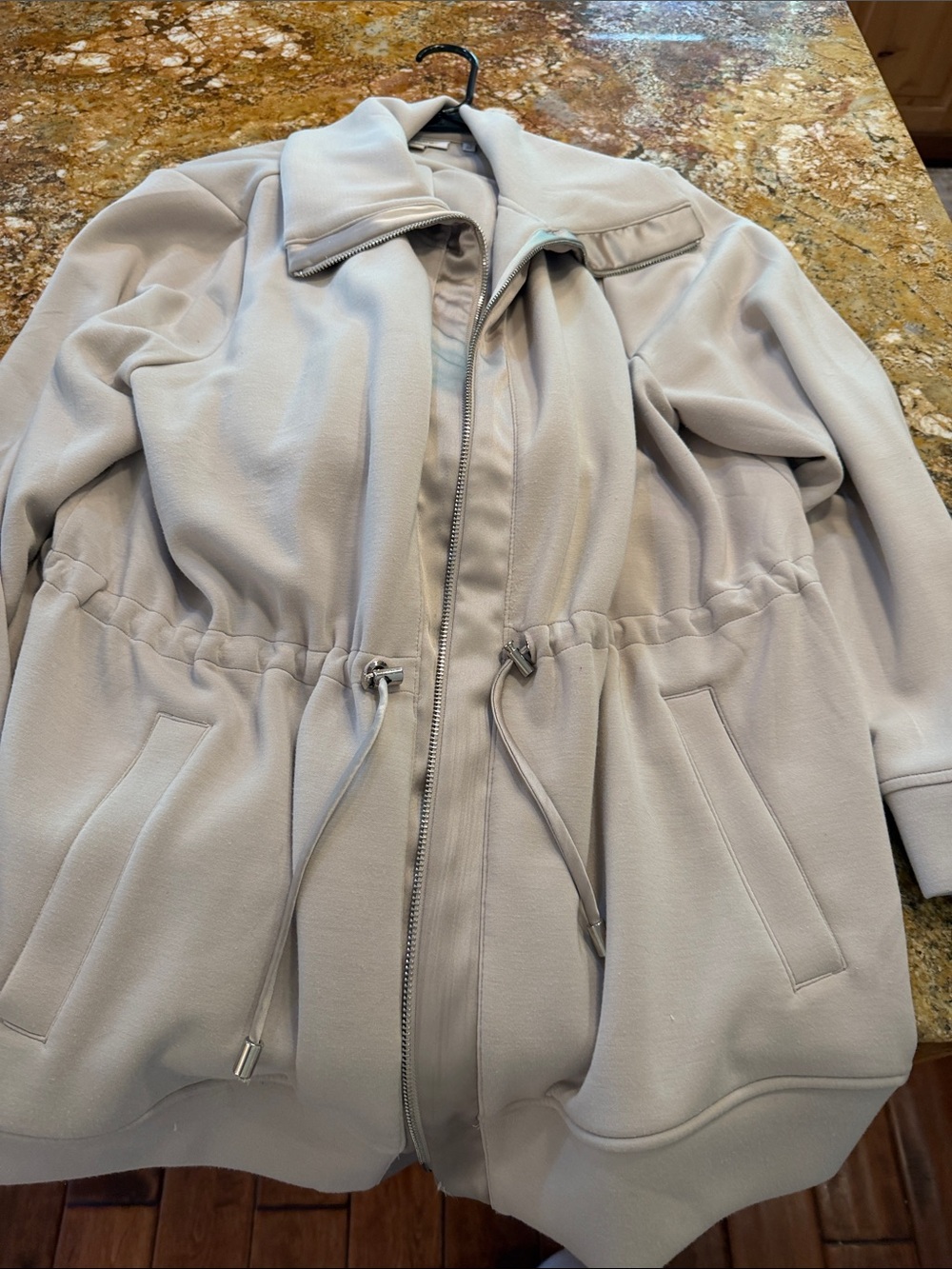 Taupe two piece jumpsuit with a drawstring waist.